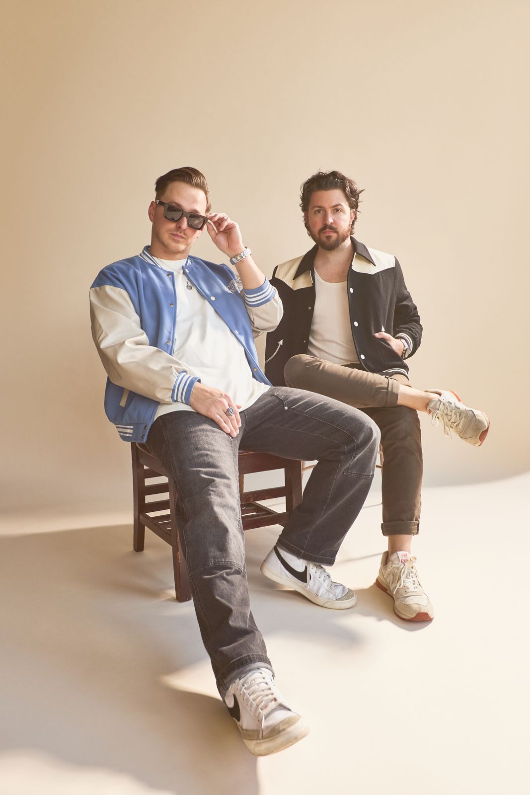 Coupe Marra, Tyler Anderson and Chris Jackson, seated in a warm beige studio
